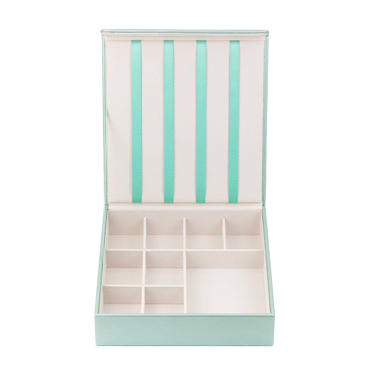 The mint green hair accessory organiser is shown against a white background. The box is empty and clearly shows the 4 ribbons attached to the lid which are designed to hold hair clips, and the grid in the bottom half which is designed to store hair bands, barrettes, hair bobbles and scrunchies